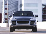 A spacious luxury SUV with a city skyline backdrop.