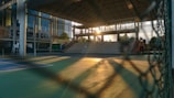 Evening lighting inside the tennis center creating a warm and inviting atmosphere.