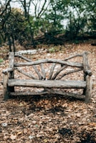 empty gray wooden park bench