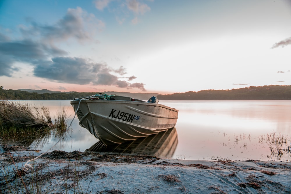 boat on the body of water photograph