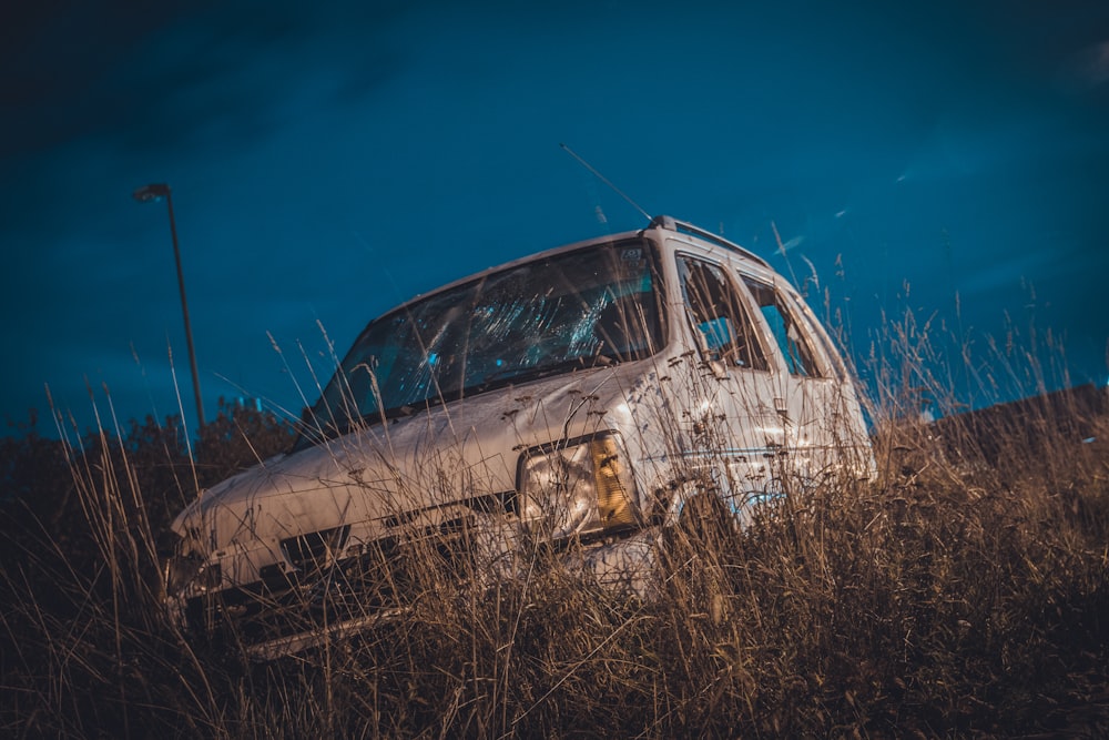 white vehicle on the grass field