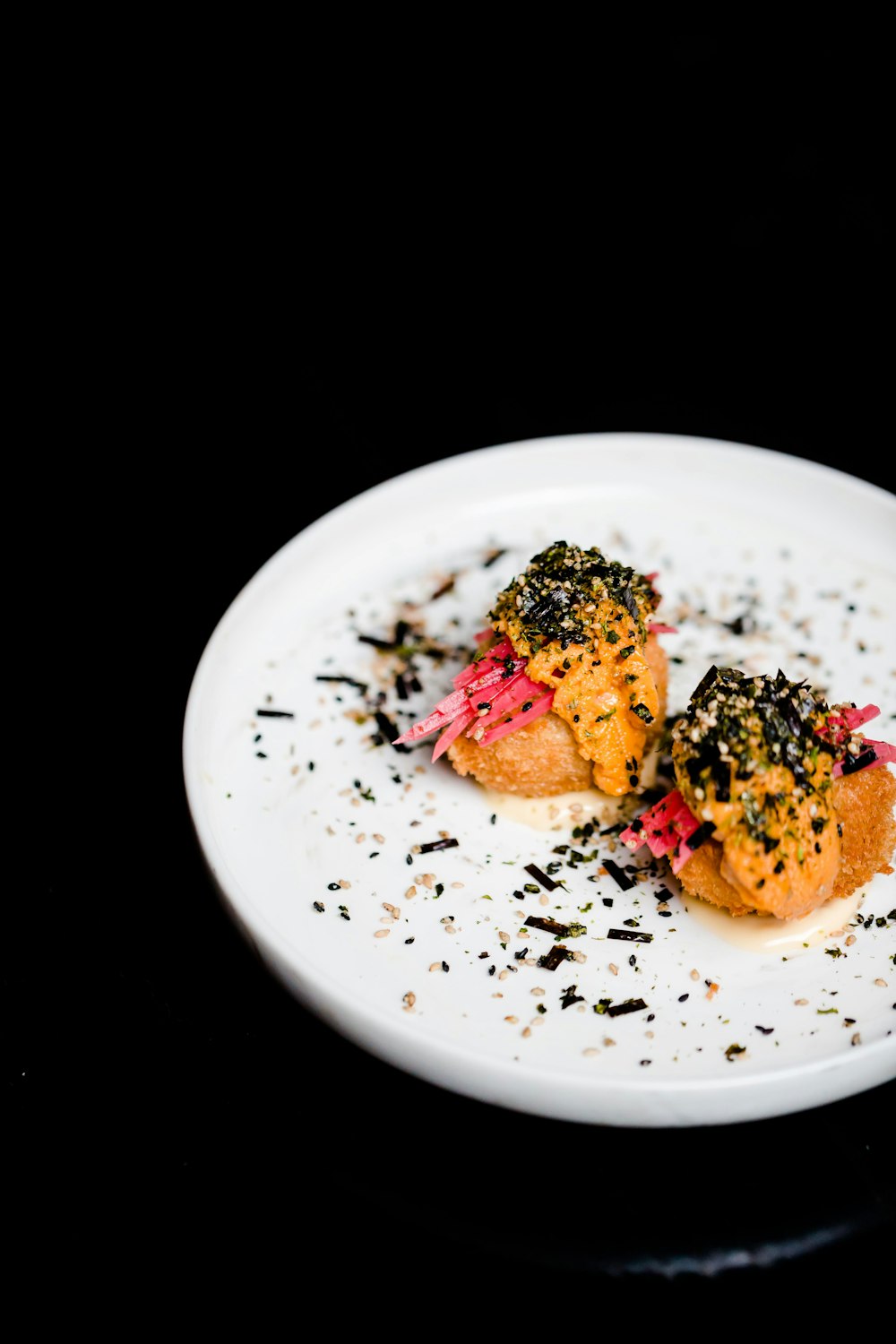 food on round white ceramic plate