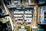 An aerial view of a busy market in an Indian city, highlighting economic activity.