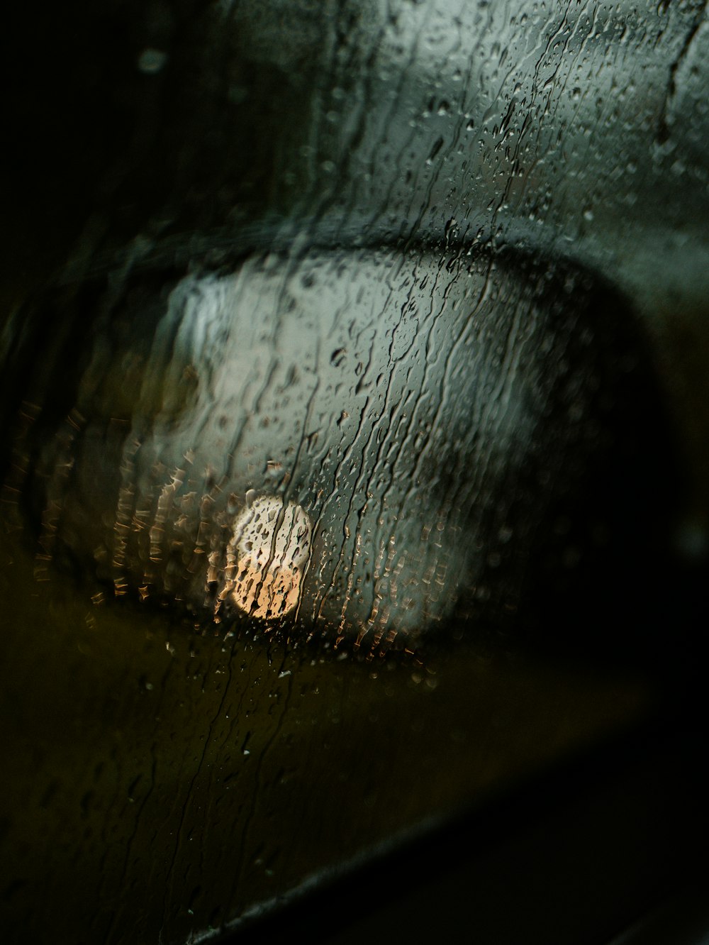 a close up of a rain covered window