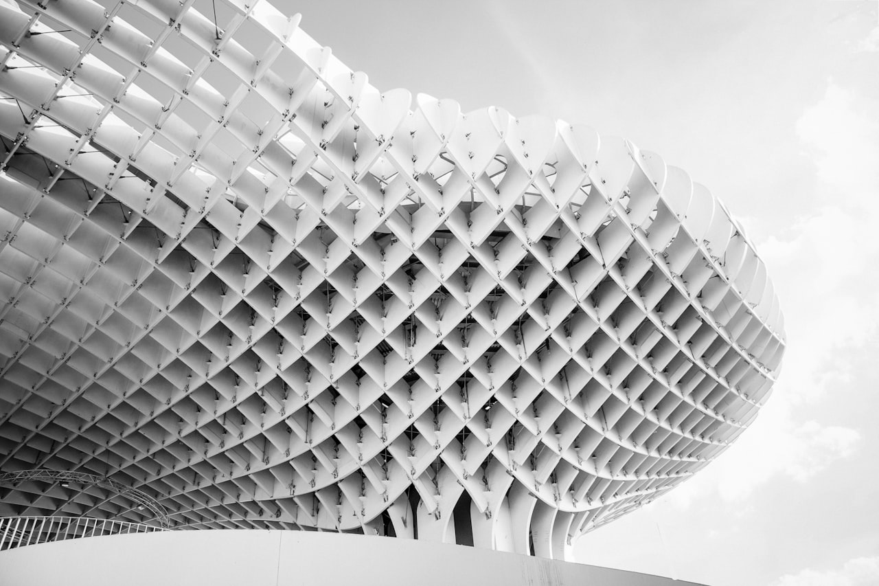 Sevilla airport beige building under blue cloudy sky