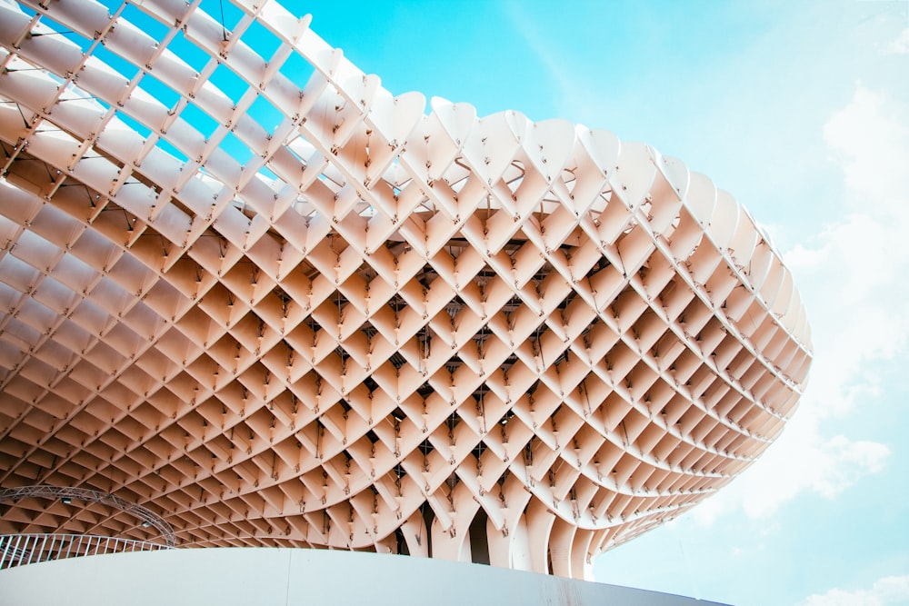 beige building under blue cloudy sky