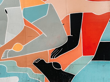 An abstract mural featuring overlapping geometric shapes and lines depicting human limbs. The composition consists of bold blocks of color and outlines that form intertwined arms, legs, and feet.