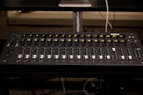 A professional mixing console in a recording studio.