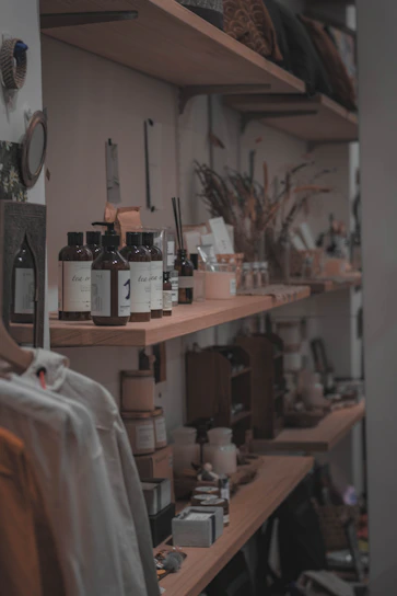 A vibrant display of assorted products neatly arranged on wooden shelves in a cozy shop setting