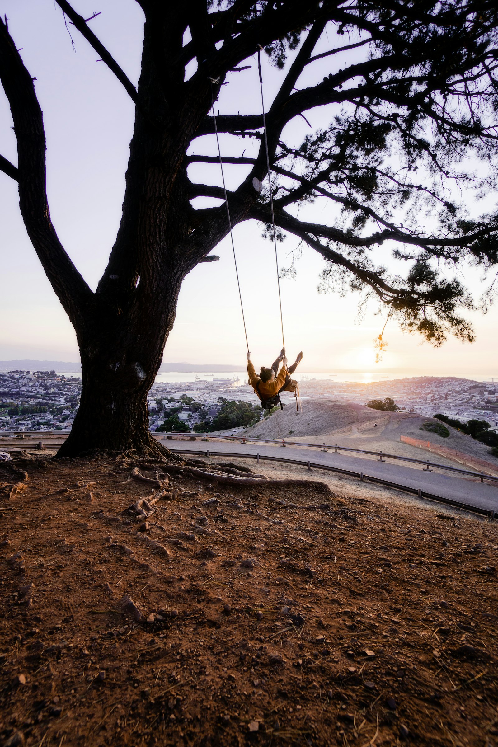 Sony a6300 + Sony E 10-18mm F4 OSS sample photo. Person sitting on swing photography