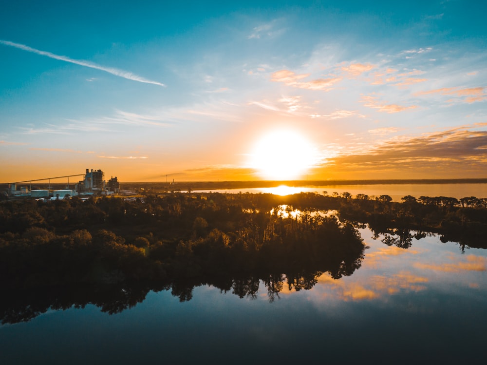 calm body of water during golden hour