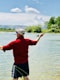 Person fly fishing in a river