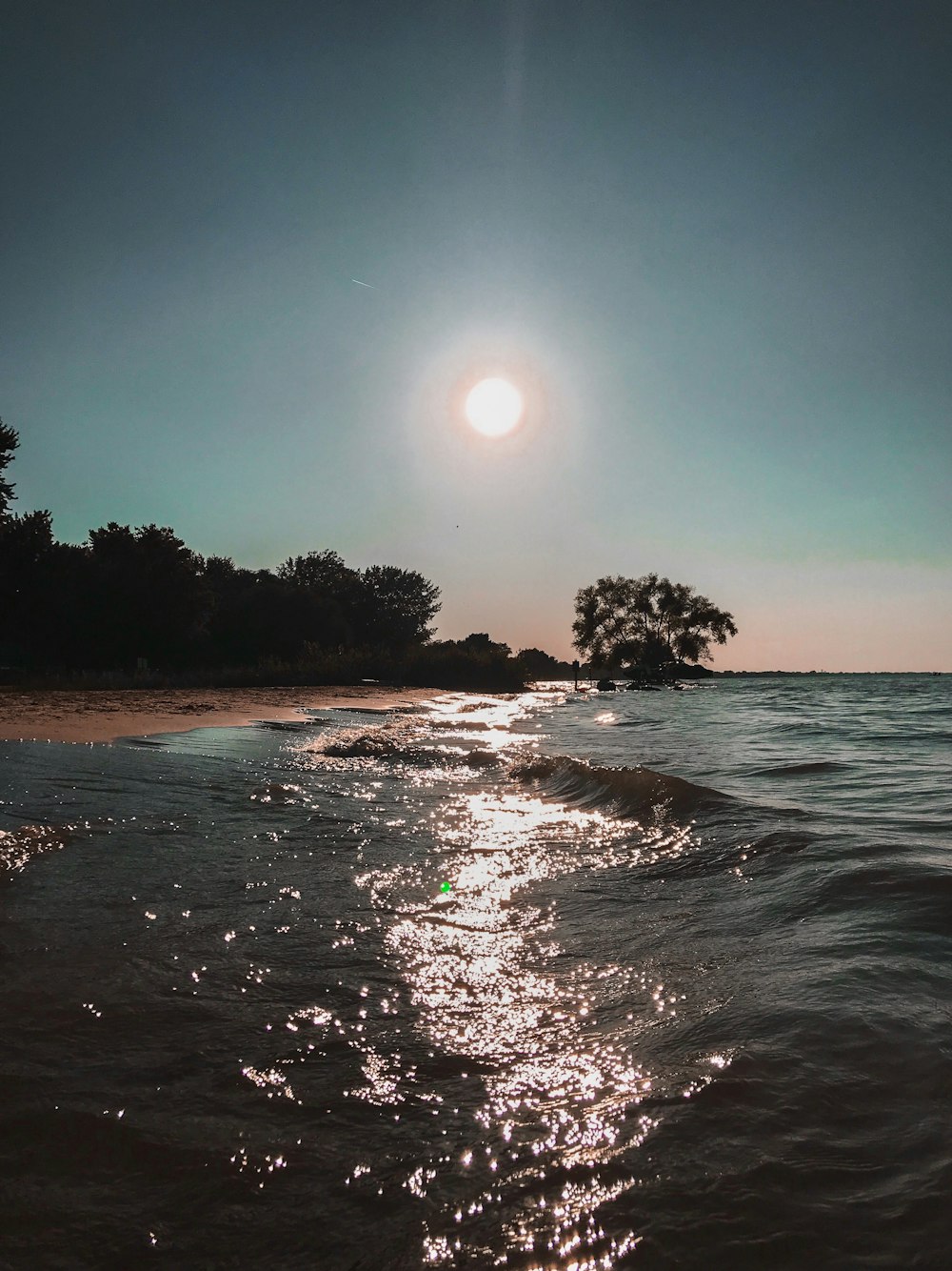 sea waves crashing on shorelinee