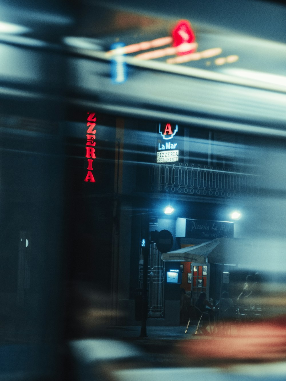 a blurry photo of a train at night