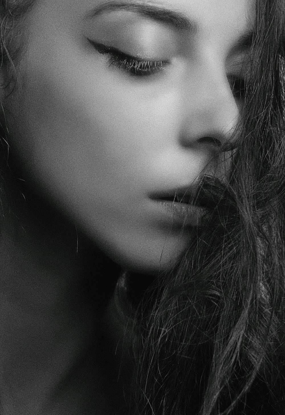 grayscale photography of woman's face