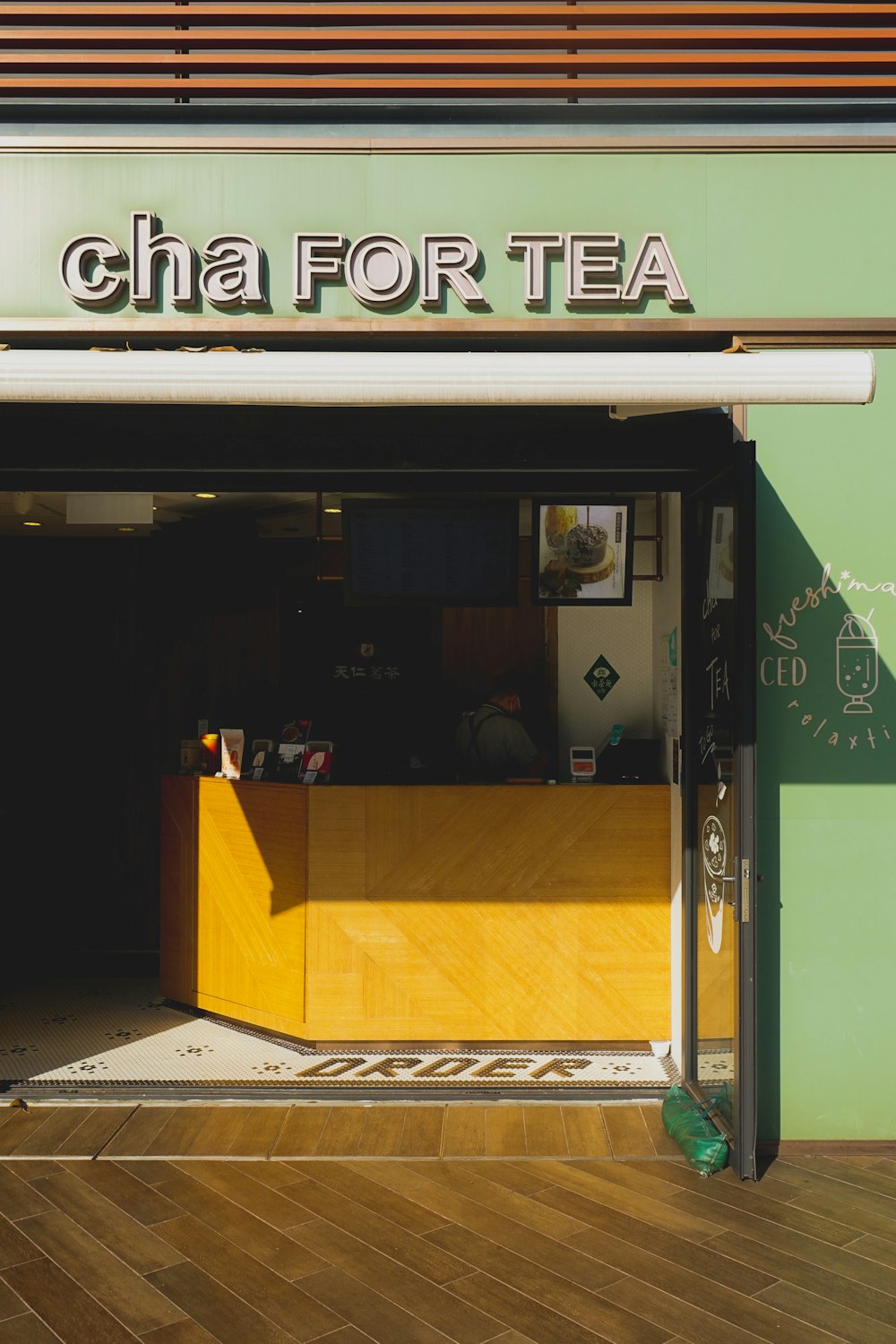 opened glass door on store facade