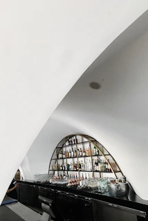 A compact, modern mini bar neatly arranged with beverages in a hotel room.