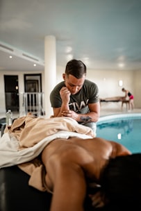 photography of man massaging a woman