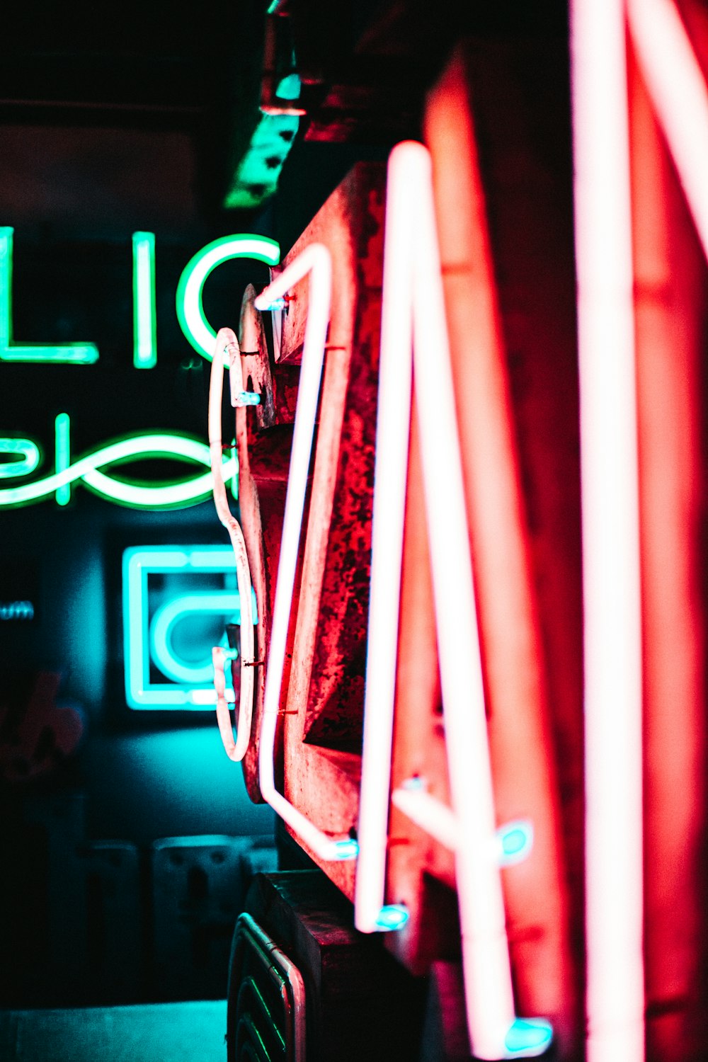 shallow focus photography of red and green neon signage