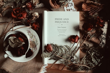 Pride and Prejudice by Jane Austen title page with dried Autumn leaves and roses and a teacup.