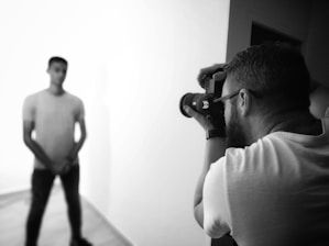 man taking photo of another man