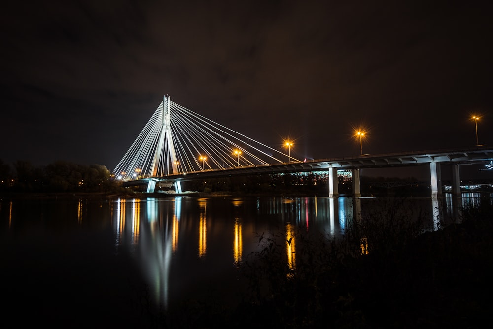 photography of bridge during nighttime