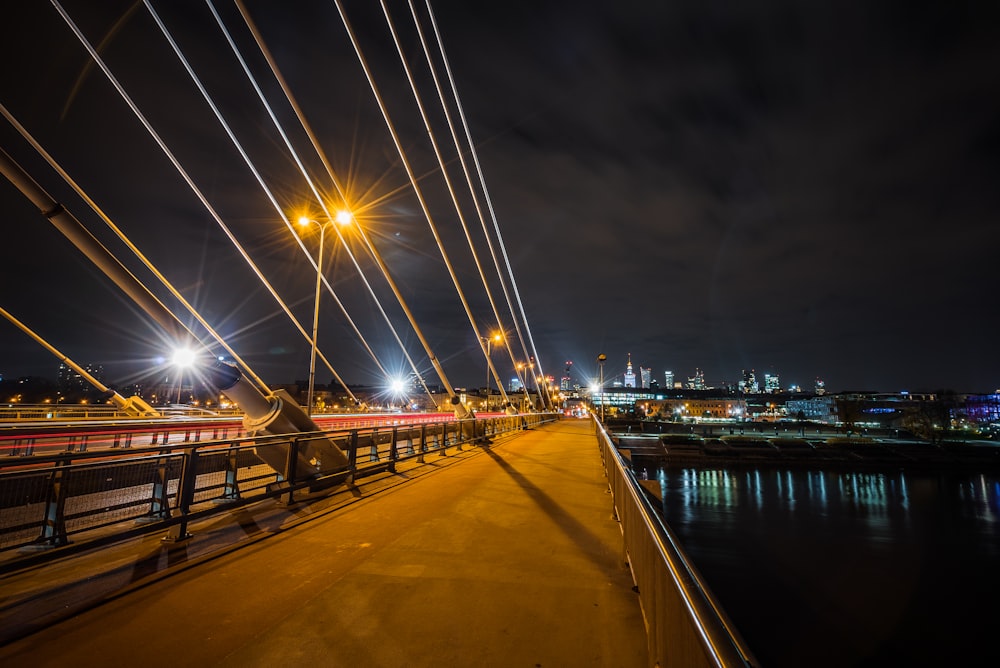 photography of bridge during nighttime