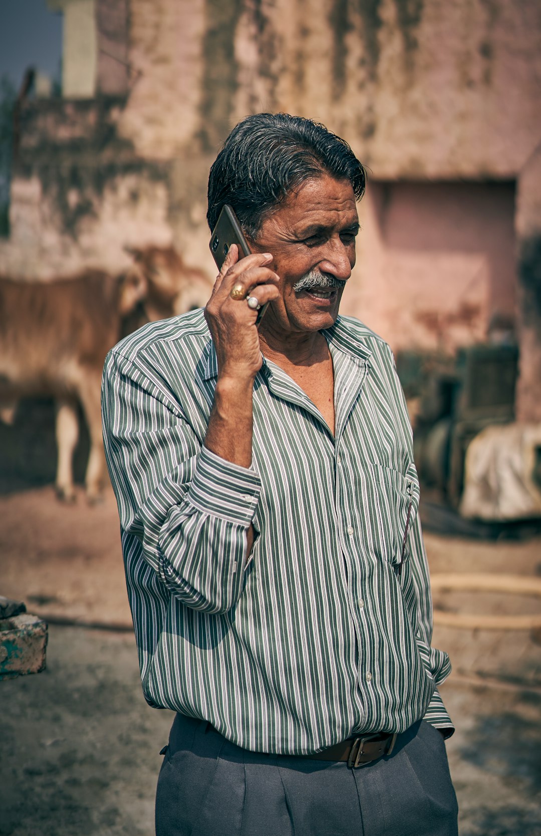 selective focus photography of man holding smartphone
