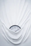 round black clock on linen