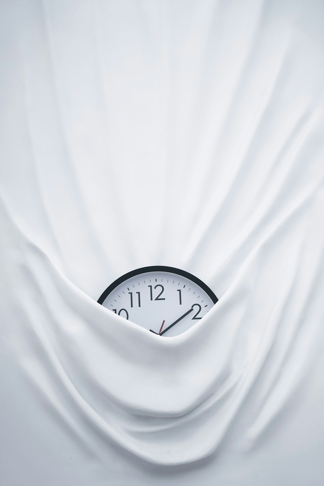  round black clock on linen clock