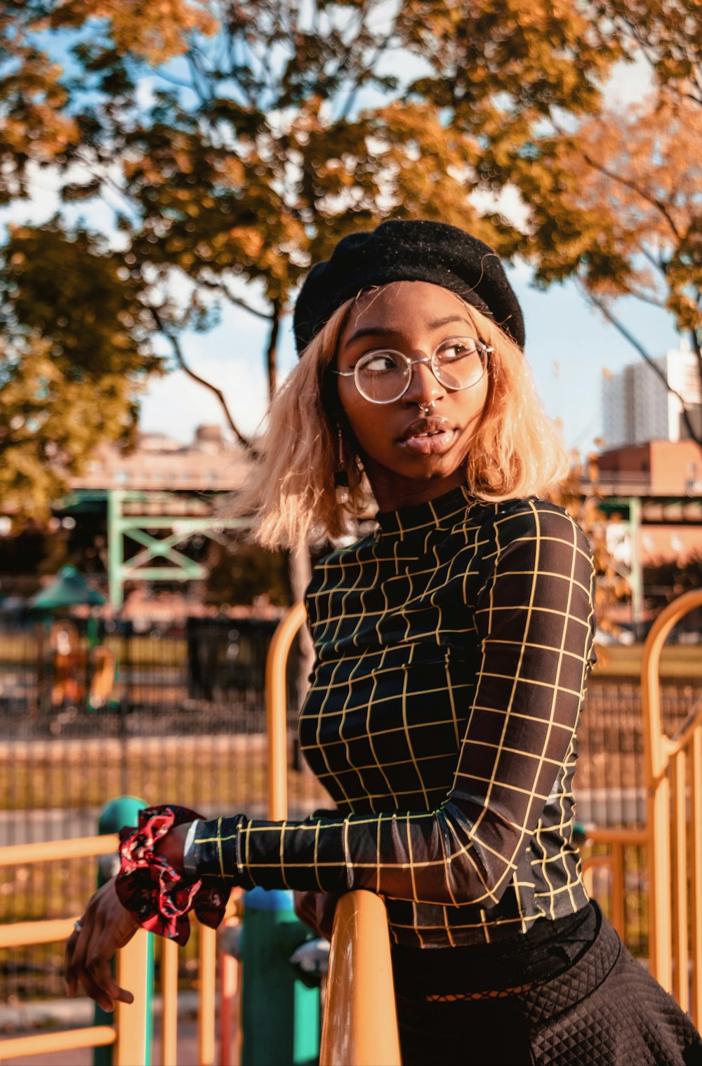 woman leaning on railing during daytime