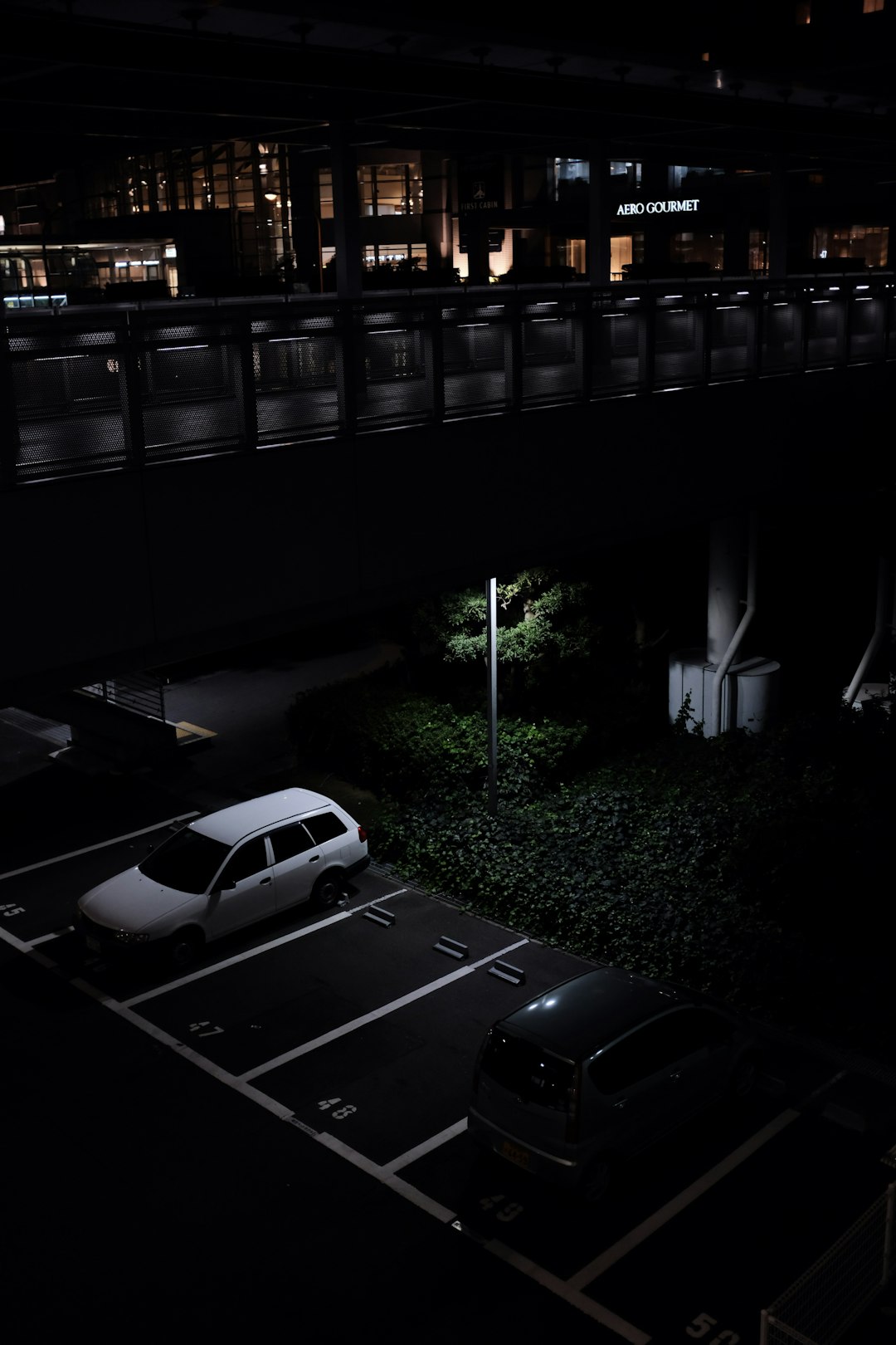 vehicles at parking lot at nighttime