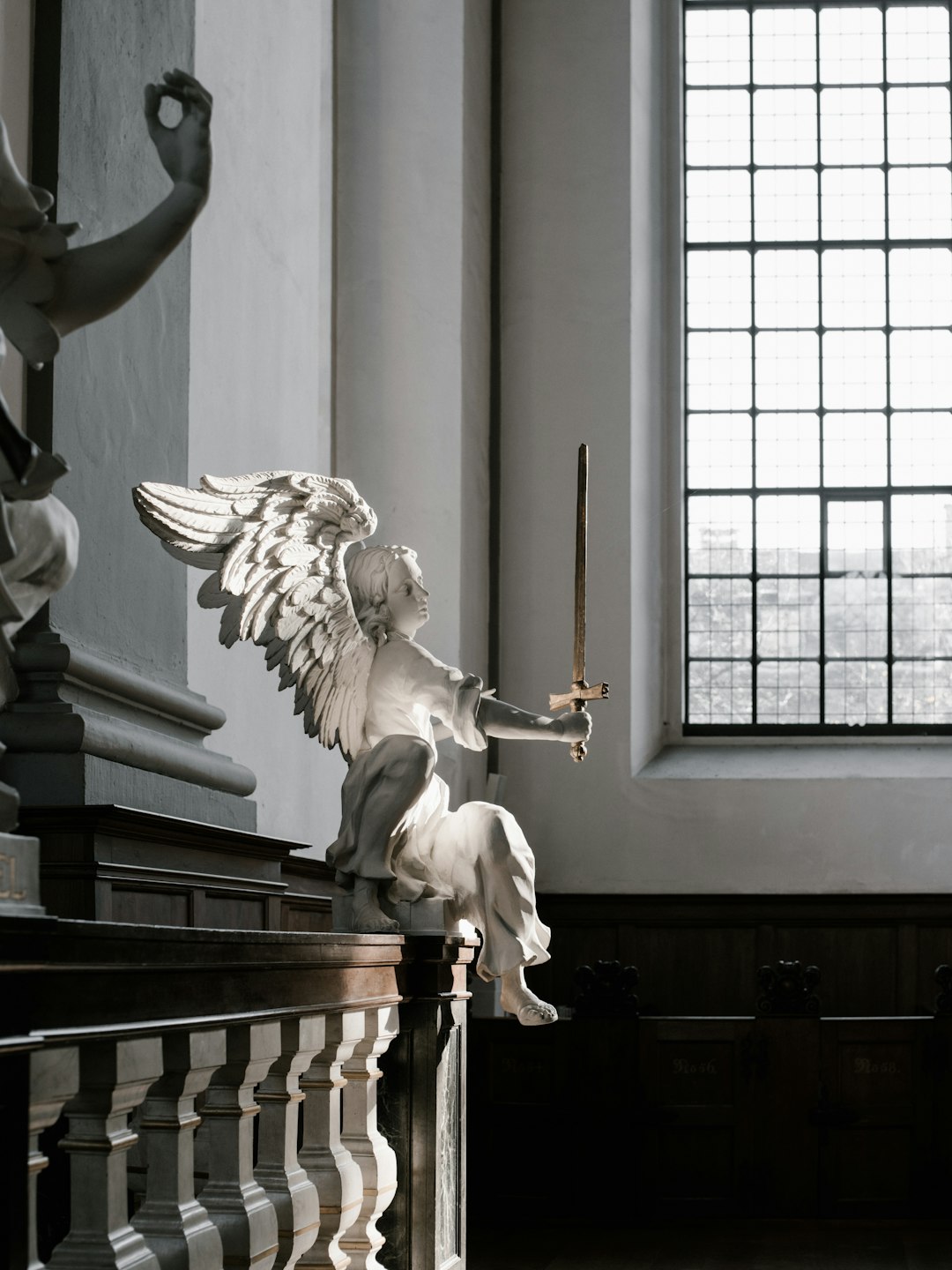 angel holding sword figurine