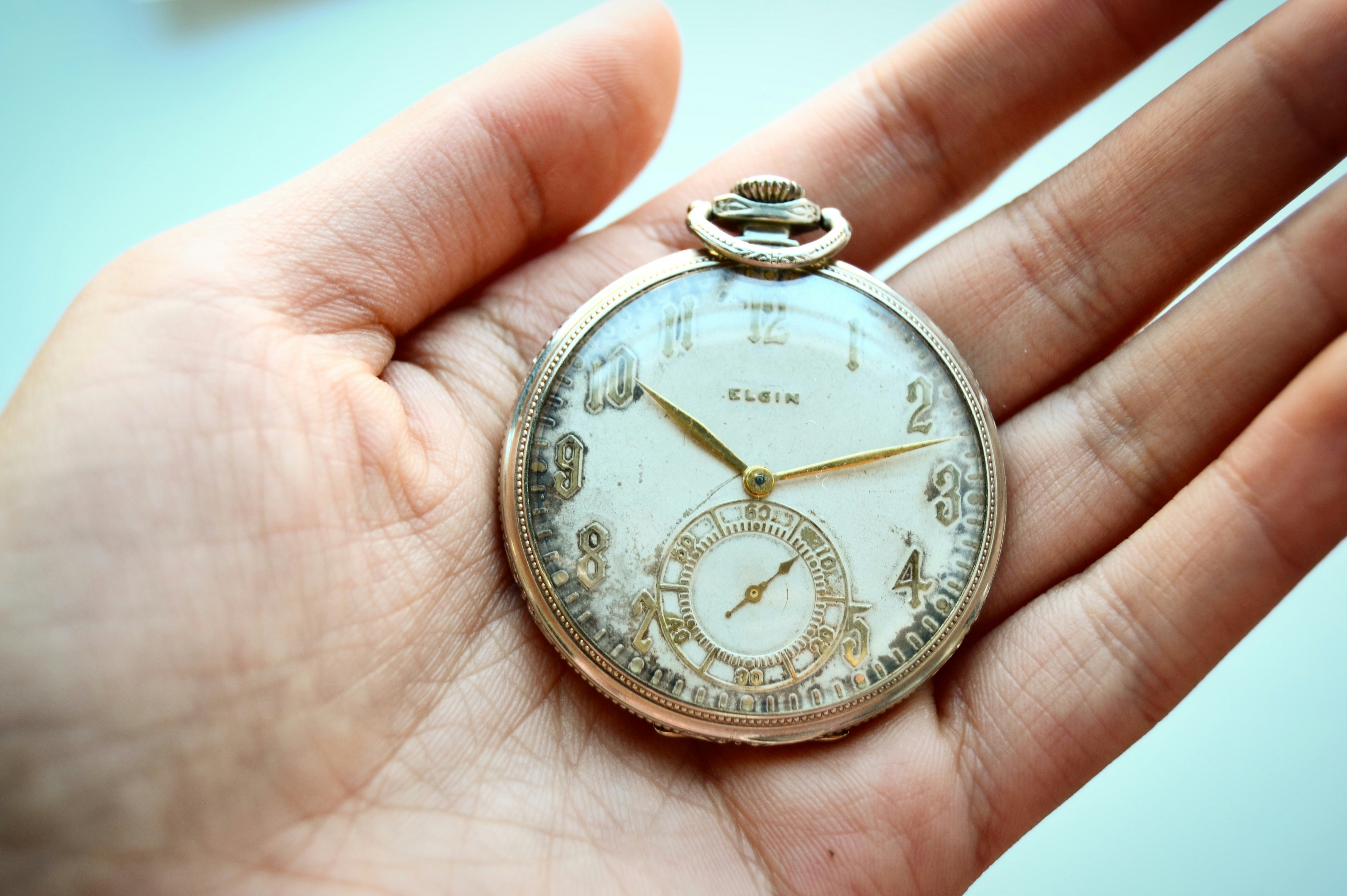 round gold pocket watch