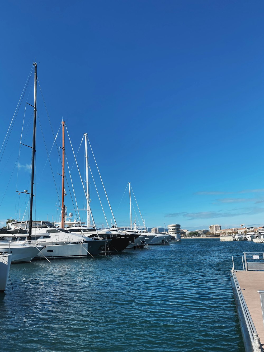 white yacht under blue sky