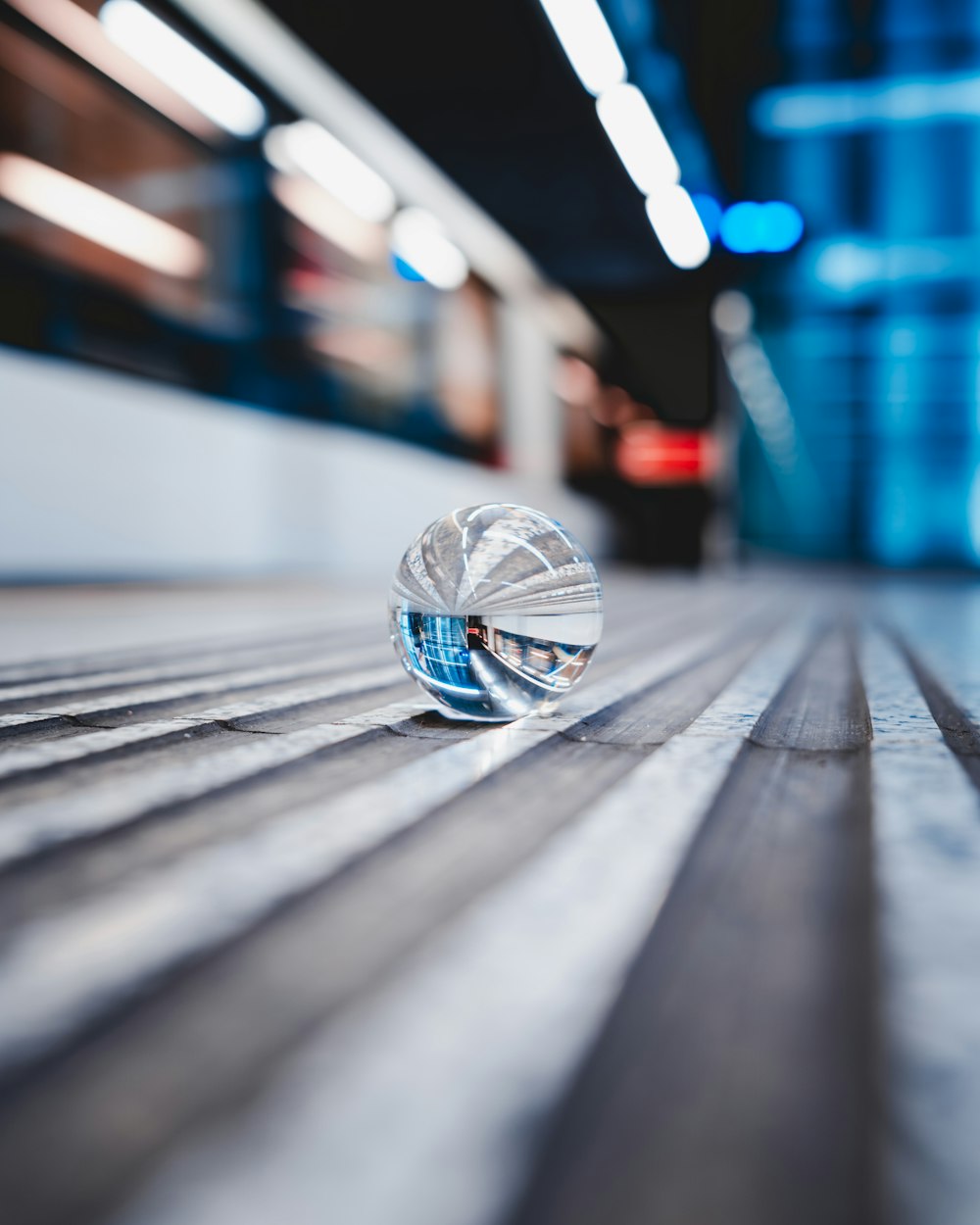 clear glass ball on floor