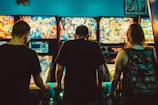 people playing arcade machines