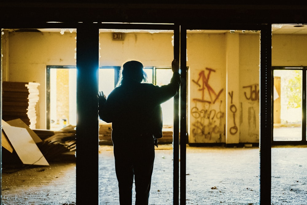 silhouette of person in empty room