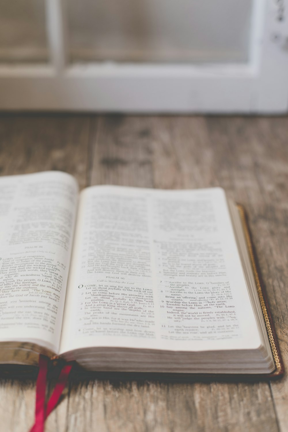 open book on brown wooden surface