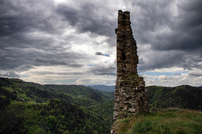A sweeping view of Vorjuun’s towering stone spires under a stormy sky.