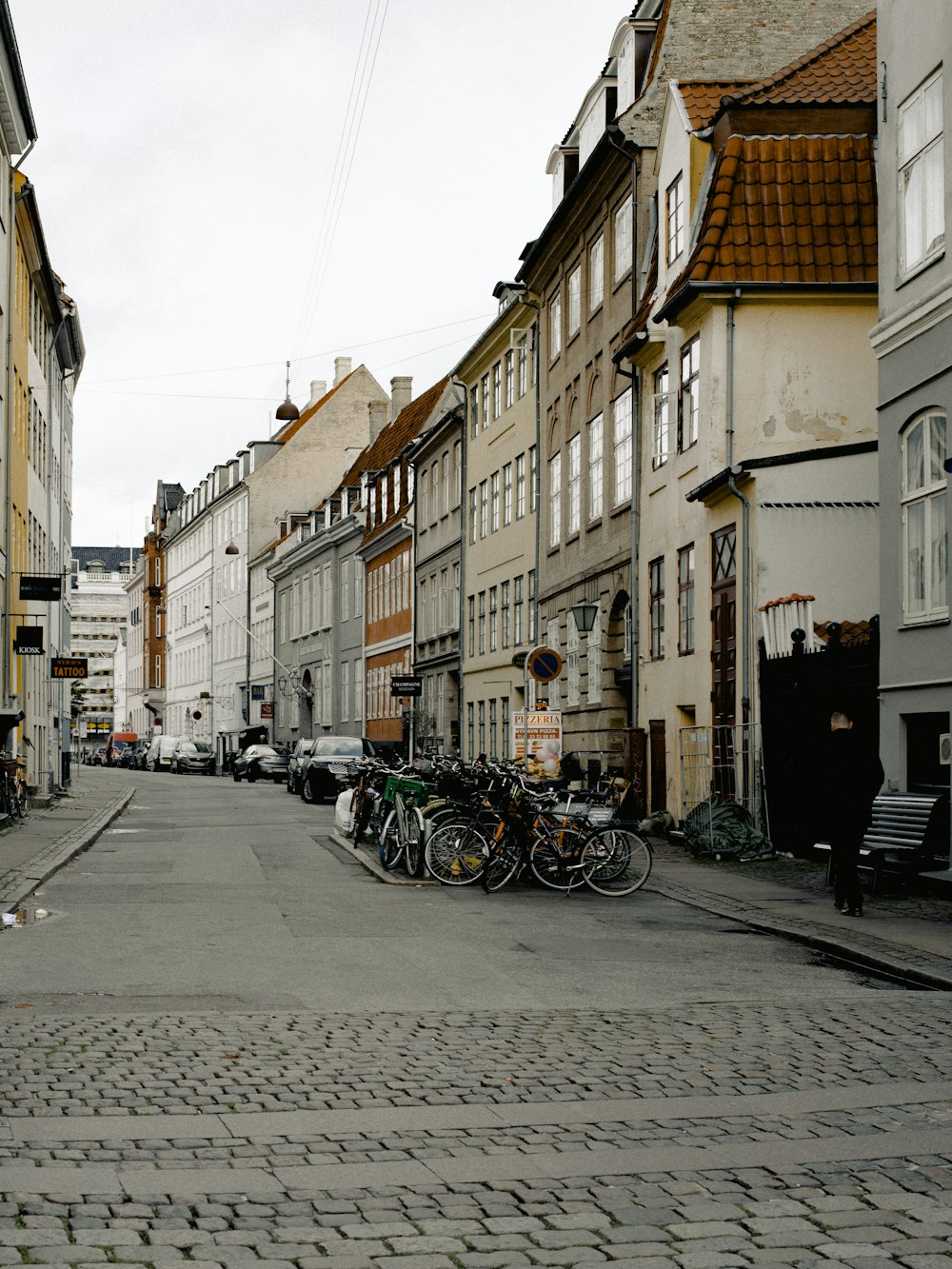 parked motorcycle on road near buildings