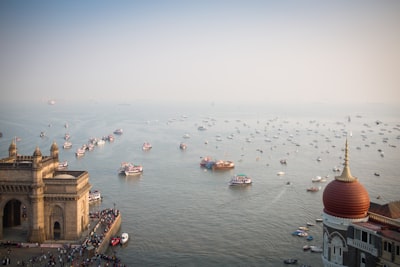 boats on body of water mumbai teams background