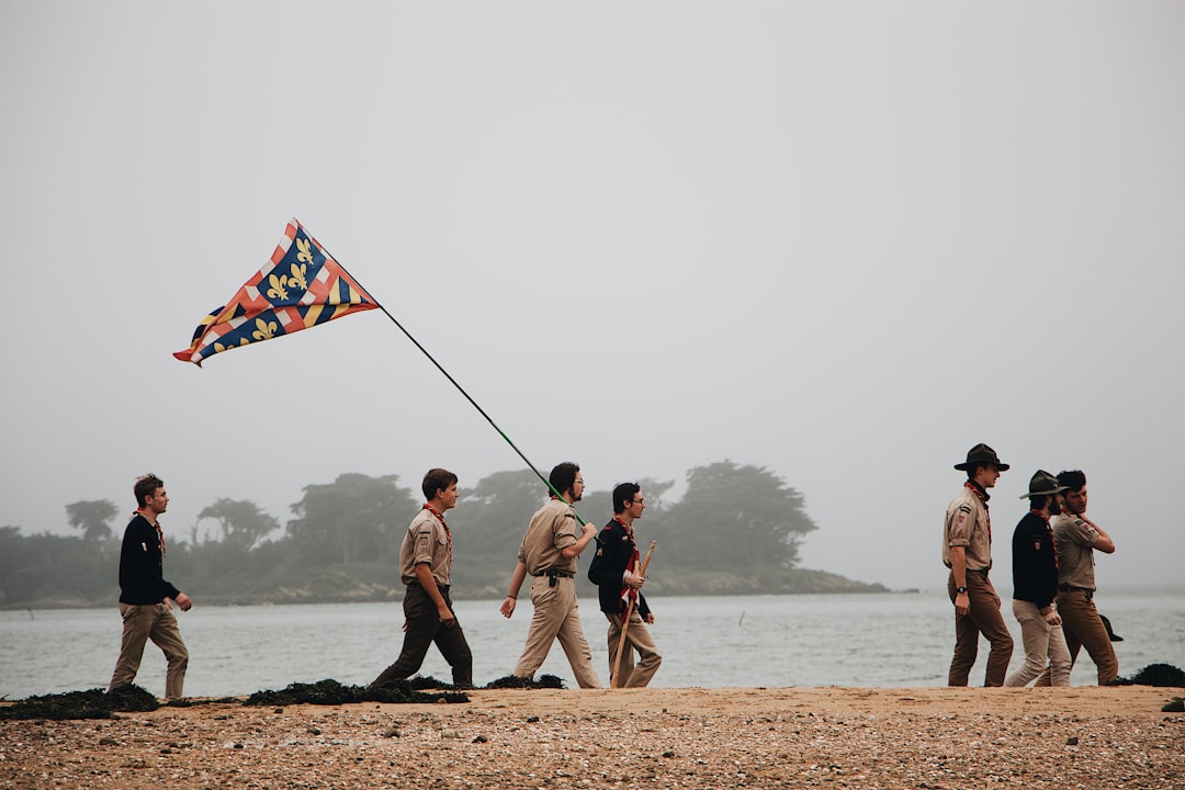 men walking on shire near body of water