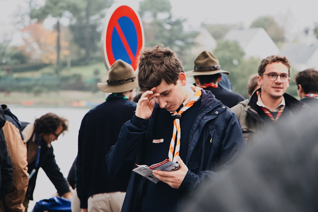 man looking at brochure