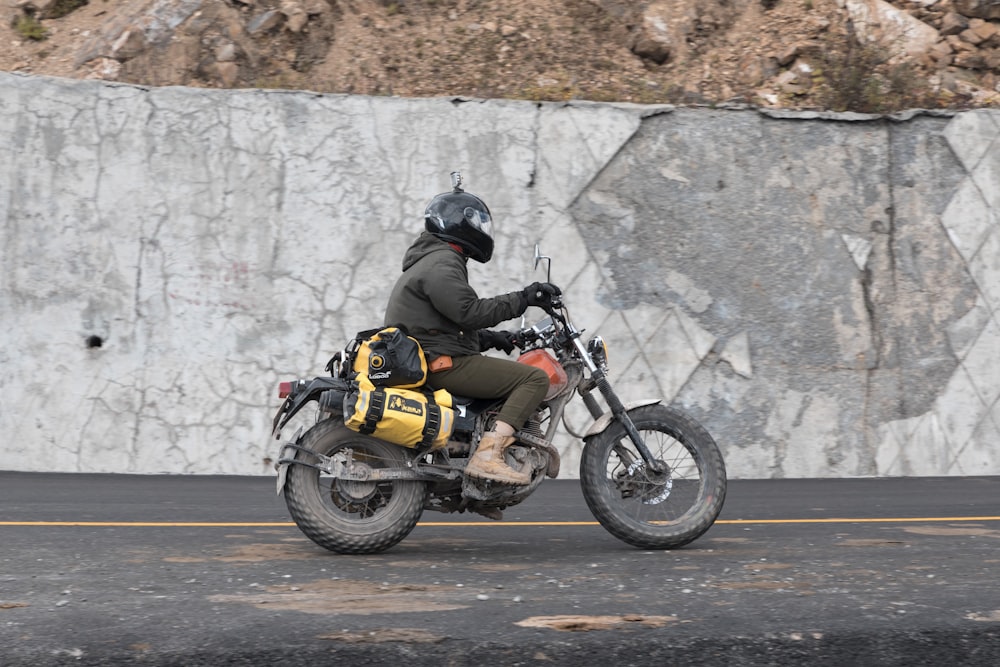 man riding on motorcycle