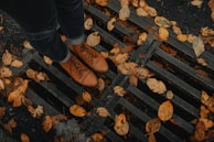Timberland boots on a gritty urban stairway with autumn leaves
