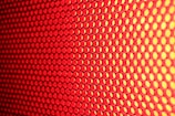 a close up of a red and yellow background
