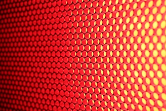 a close up of a red and yellow background