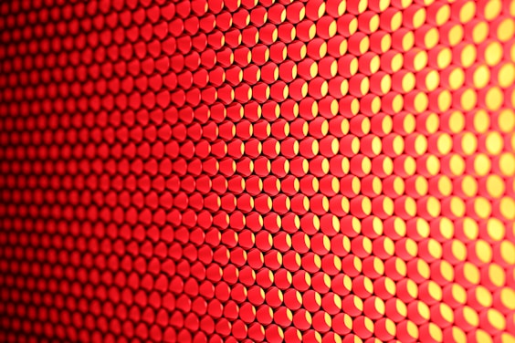 a close up of a red and yellow background