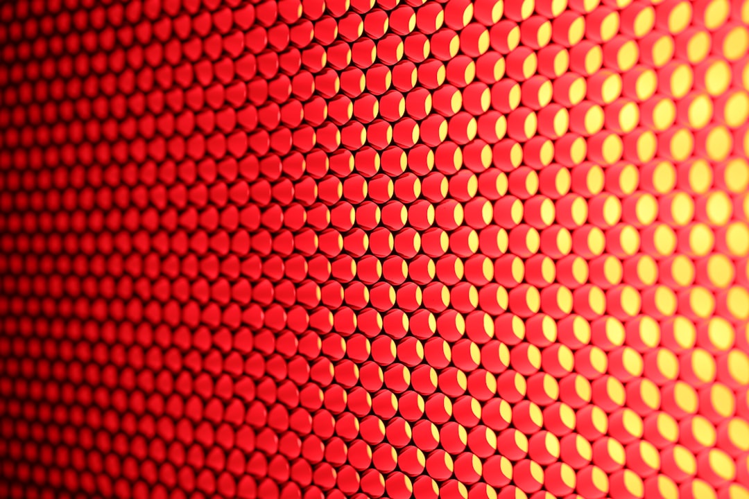 a close up of a red and yellow background, Texture. Professional led panel for tv broadcasting, producing beautiful red light.